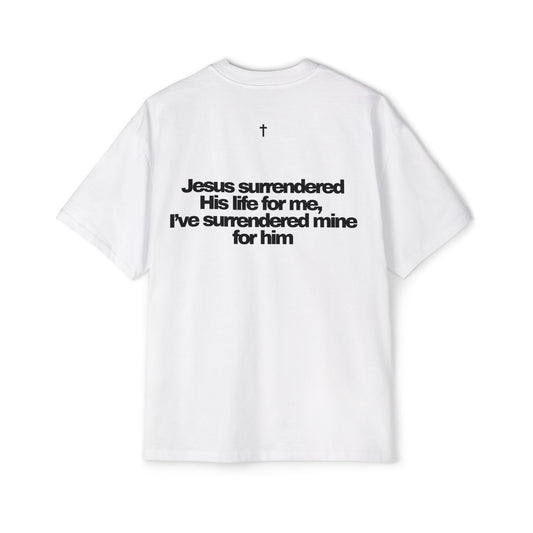 Back of Surrendered Apparel white oversized Christian T-shirt featuring "Jesus surrendered his life for me, I've surrendered for him" in bold black text, cross on top, providing a cozy fit perfect for cooler days and sharing faith.