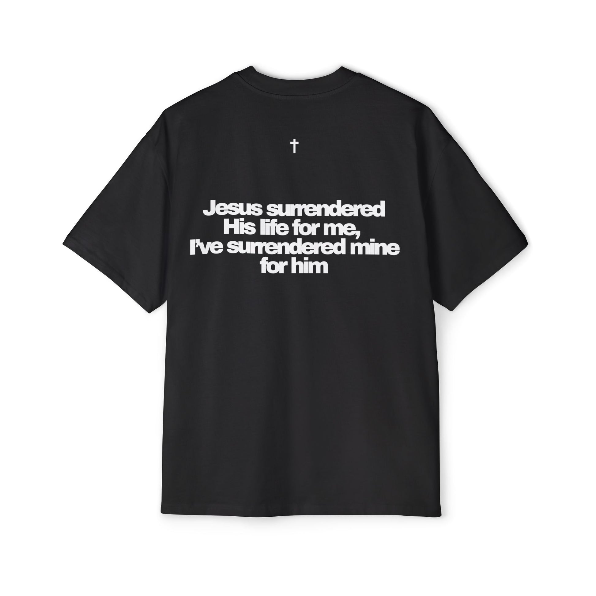 Back of Surrendered Apparel black oversized Christian T-shirt featuring "Jesus surrendered his life for me, I've surrendered for him" in bold white text, cross on top, providing a cozy fit perfect for cooler days and sharing faith.