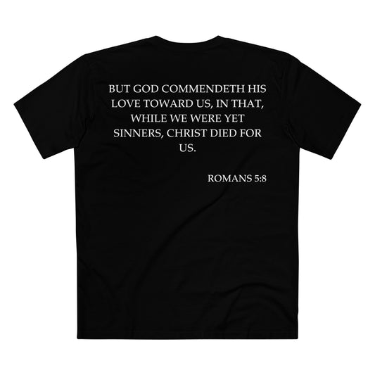 Back of Surrendered Apparel black Christian T-shirt featuring the Bible verse Romans 5:8 in bold text, perfect for sharing faith and Jesus