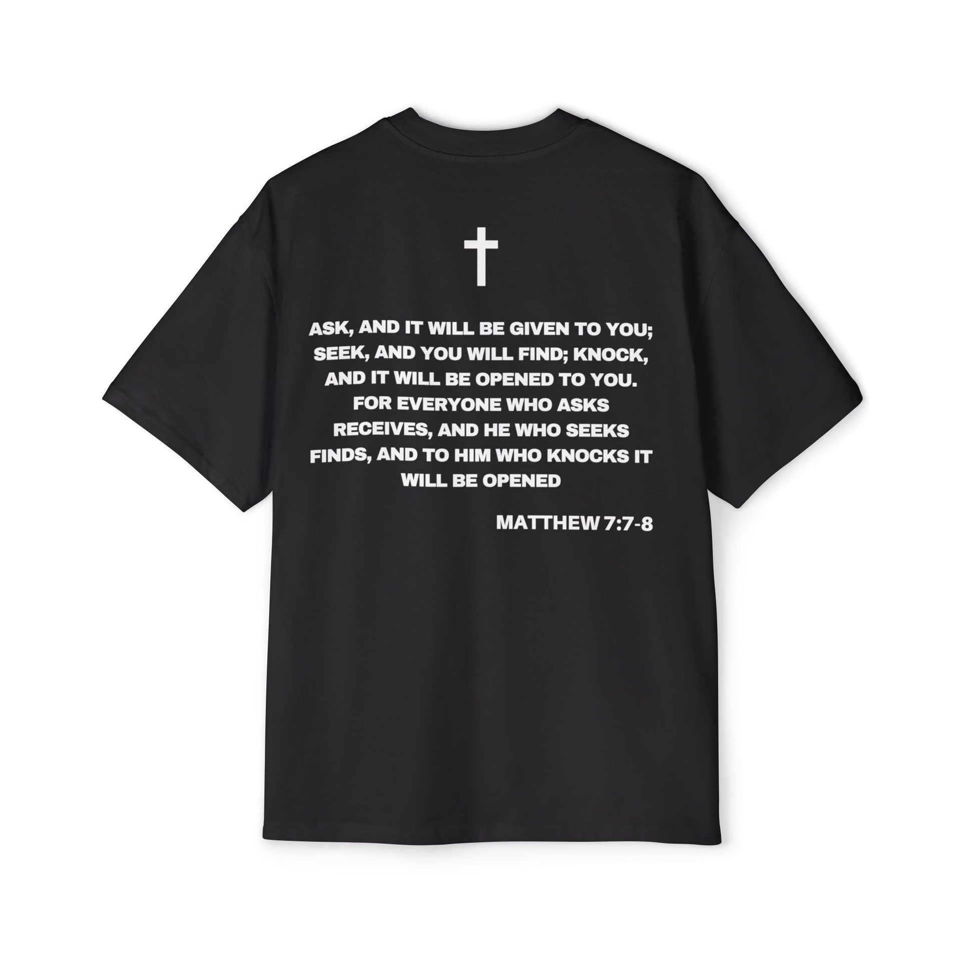 Back of Surrendered Apparel black oversized Christian T-shirt featuring the Bible verse Matthew 7:7-8 in bold text, providing a cozy fit perfect for cooler days and sharing faith.