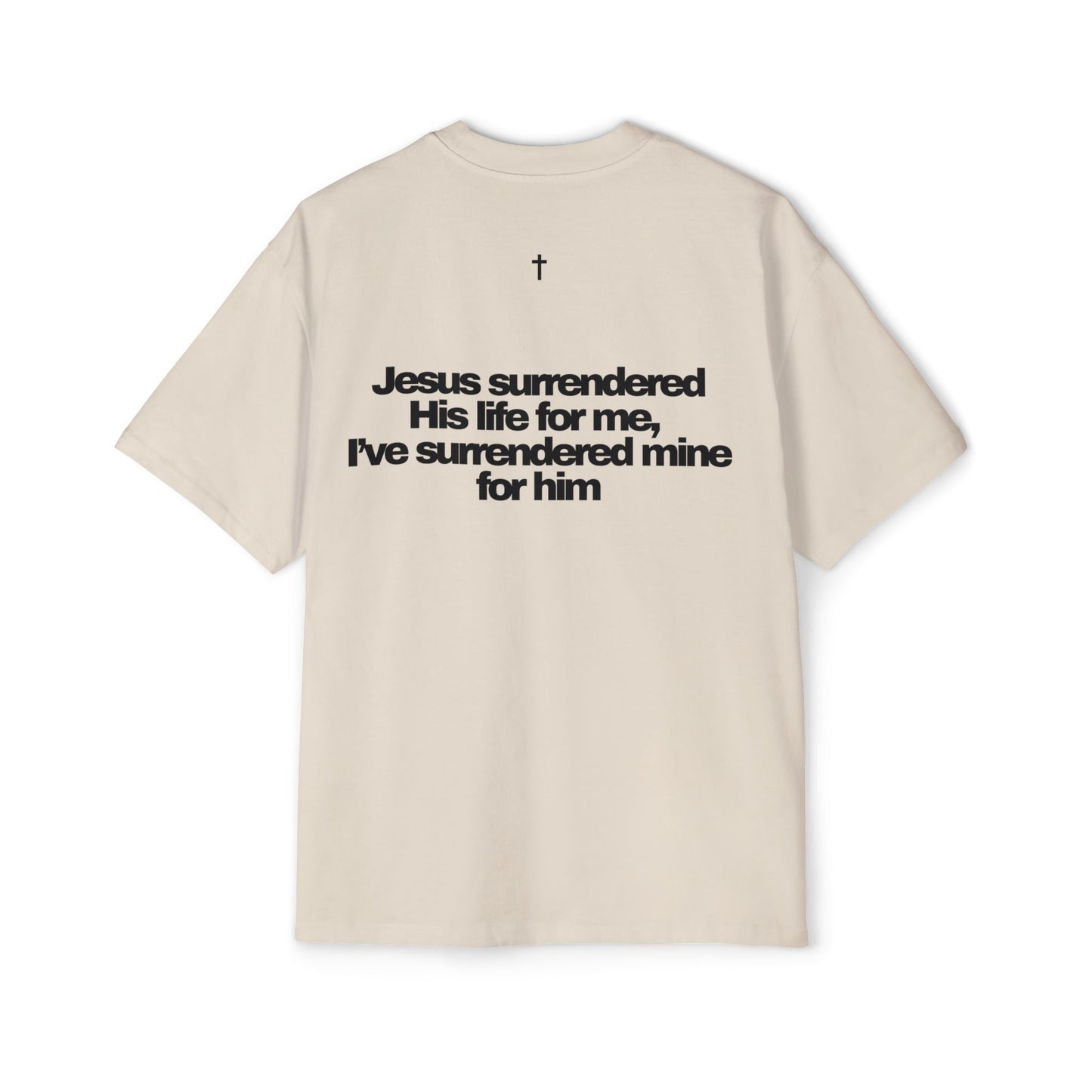 Back of Surrendered Apparel cream oversized Christian T-shirt featuring "Jesus surrendered his life for me, I've surrendered for him" in bold black text, cross on top, providing a cozy fit perfect for cooler days and sharing faith.