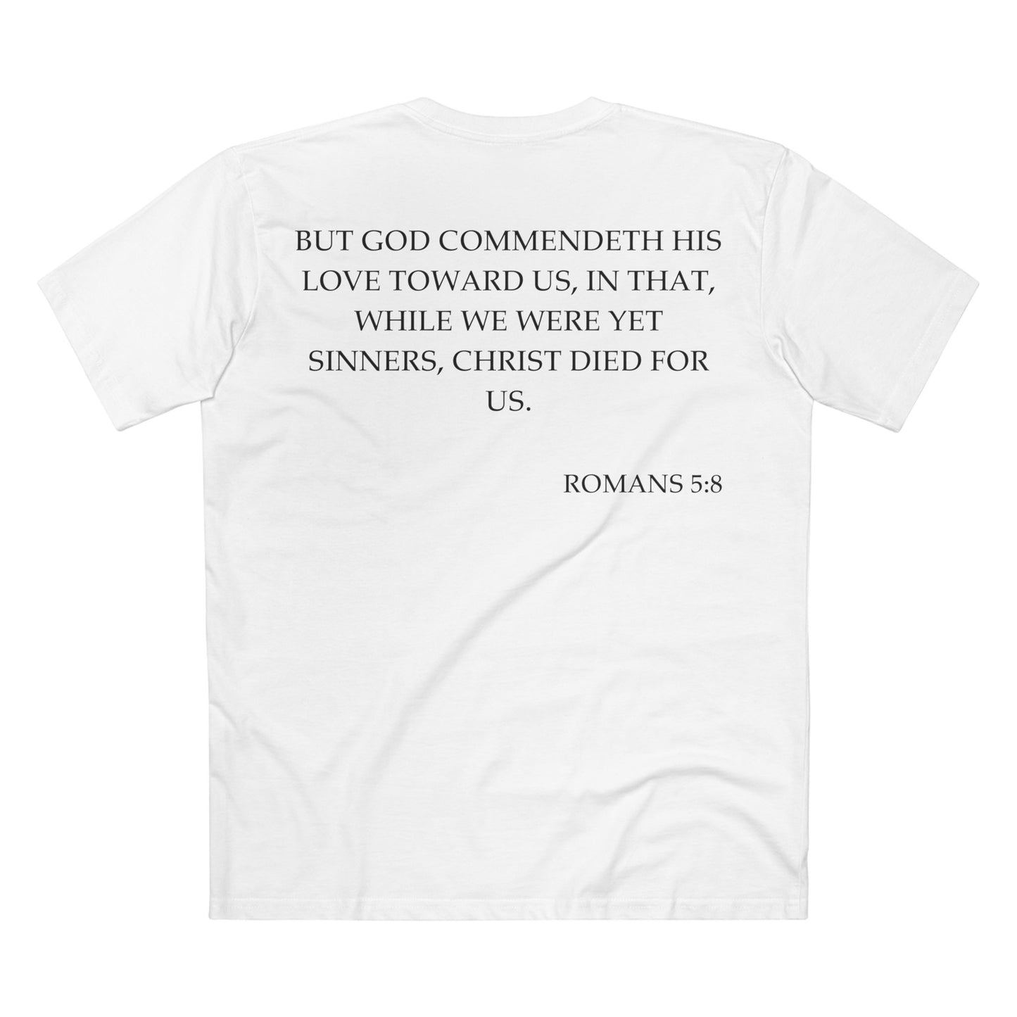 Back of Surrendered Apparel white Christian T-shirt featuring the Bible verse Romans 5:8 in bold text, perfect for sharing faith and Jesus