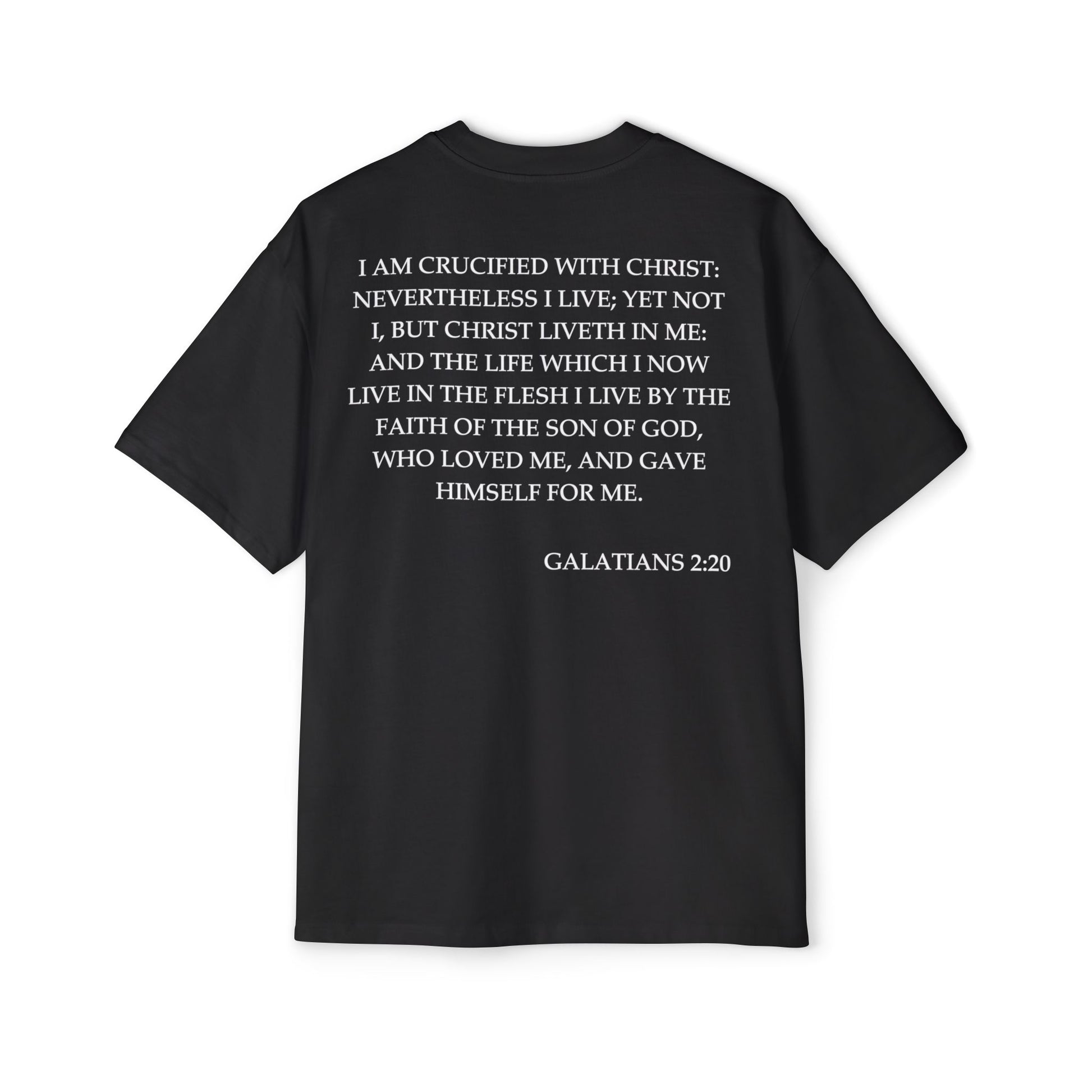 Back of Surrendered Apparel black oversized Christian T-shirt featuring the Bible verse Galatians 2:20 in bold white text, providing a cozy fit perfect for cooler days and sharing faith