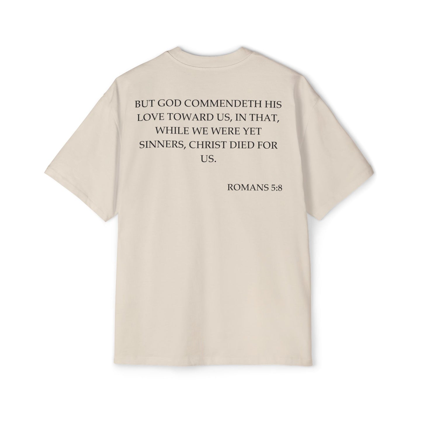 Back of Surrendered Apparel cream oversized Christian T-shirt featuring the Bible verse Romans 5:8 in bold black text, providing a cozy fit perfect for cooler days and sharing faith