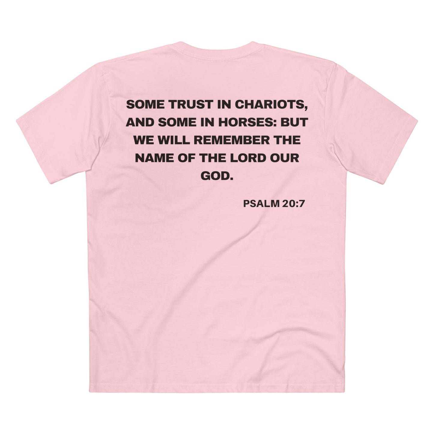 Back of Surrendered Apparel pink Christian T-shirt featuring the Bible verse psalm 20:7 in bold text, perfect for sharing faith and Jesus