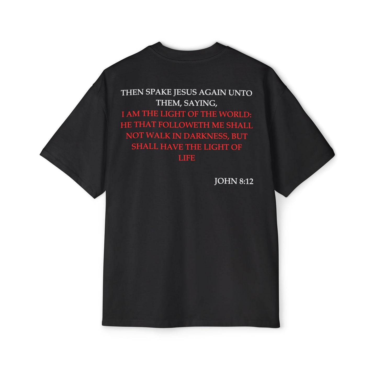 Back of Surrendered Apparel black oversized Christian T-shirt featuring the Bible verse John 8:12 in bold white and red text, providing a cozy fit perfect for cooler days and sharing faith.